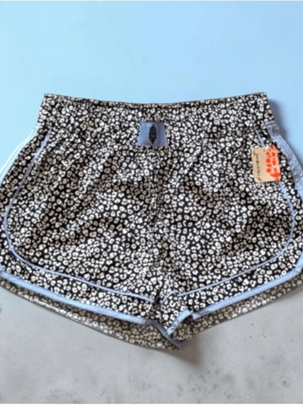 Black & White Leopard Print Women's Athletic Shorts with Light Blue Trim